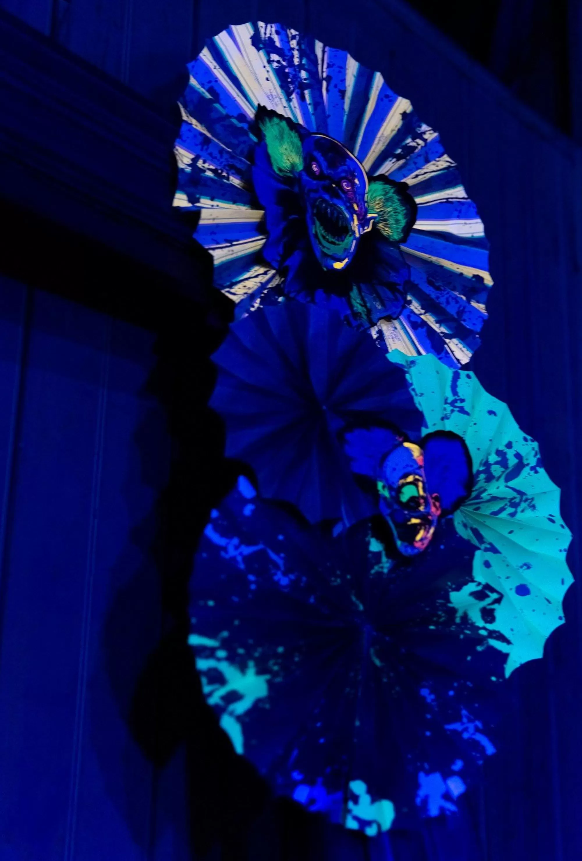 Party City Creepy Carnival | Creepy Carnival Black Light Reactive Paper Fan Decorating Kit, 15Pc